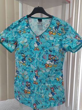 Disney Teal Daisy Duck Scrub Top with Pink & Yellow Accents